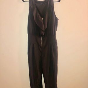 Black jump suit, gold zipper.